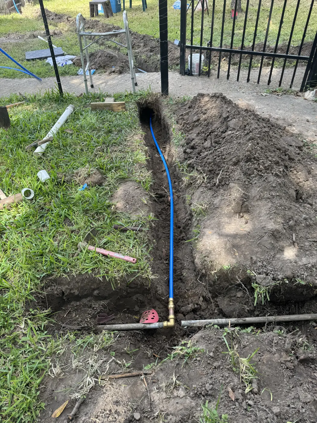 Water line trench for a new backflow and supply connection